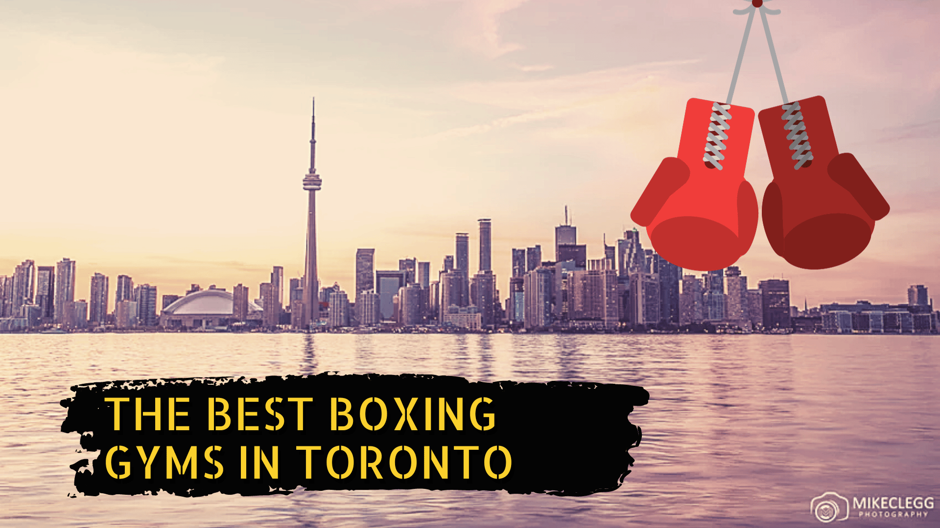 Toronto skyline, some boxing gloves, and the title the best boxing gyms in Toronto